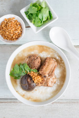 Rice porridge boiled pork ribs with shitake mushroom. Top view.