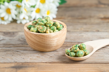 Crispy green peas in wood cup.
