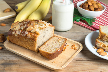Banana cake topping with almond slice.