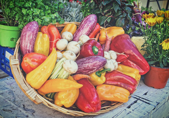 Vegetables in basket on wooden table