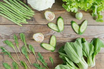 Green vegetables on wood background