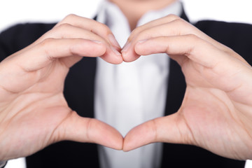 Business woman making heart shape with her hands