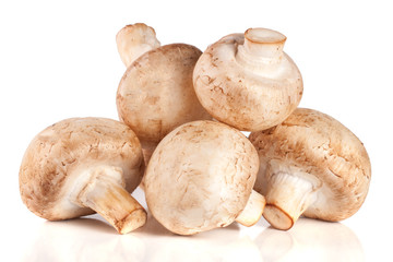 A bunch of champignon mushrooms isolated on white background