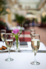 Glasses with champagne on the tables