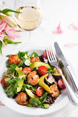 Avocado shrimp salad with cherry tomatoes