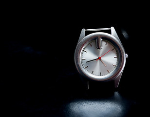 Watch on black leather .