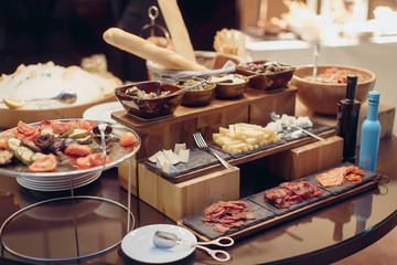 Buffet antipasti snacks cheese meat, olive salad