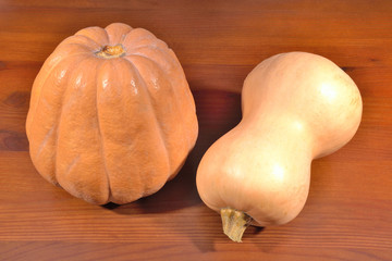 two pumpkin at the wooden table