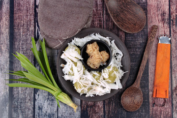 Steamed flour wrap sweet mashed coconut topped soft coconut roll.