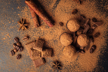 Chocolate truffle,Truffle chocolate candies with cocoa powder.Homemade fresh energy balls with chocolate.Gourmet assorted truffles made by chocolatier.Chunks of chocolate and coffee beans