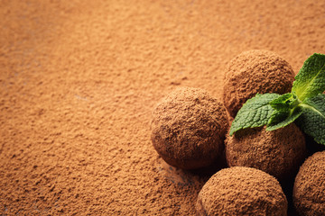 Chocolate truffle,Truffle chocolate candies with cocoa powder.Homemade fresh energy balls with chocolate.Gourmet assorted truffles made by chocolatier.Chunks of chocolate and coffee beans