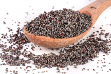 poppy seeds in a wooden spoon isolated on white background