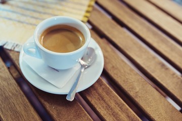 White cup with hot coffee