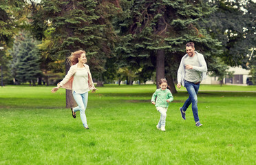 happy family walking in summer park