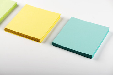 Notebooks with colored leaves on white background.