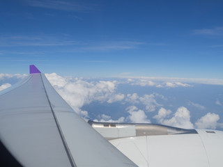 Fototapeta na wymiar Wing of the plane on a background of sky