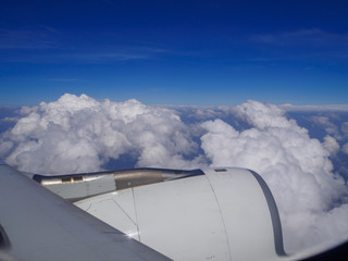Fototapeta na wymiar Wing of the plane on a background of sky