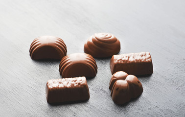 Chocolates on black background. Food.