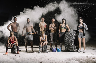 Group of athlete posing with sport equipment © Jose Luis Carrascosa Martinez/ADDICTIVE STOCK