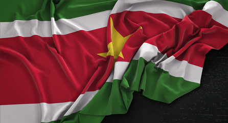 Suriname Flag Wrinkled On Dark Background 3D Render
