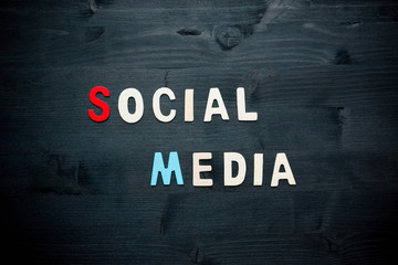 Fototapeta na wymiar wooden word social media on background business concept