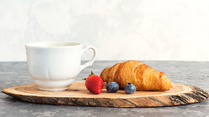 Cup of coffee and croissants on white background. Morning breakfast