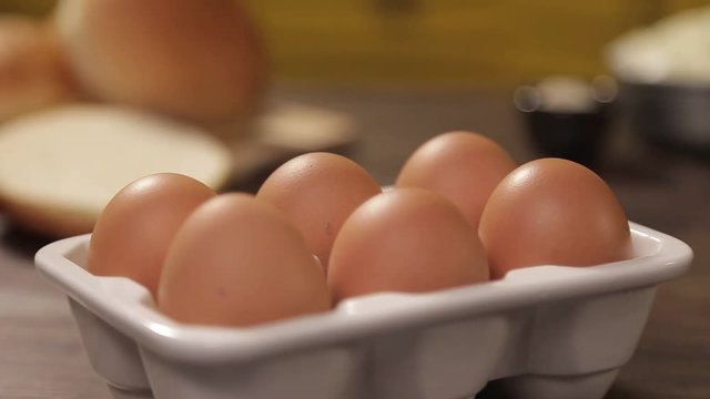 Eggs - 6 Brown Eggs In White Holder - Tilt - Top To Bottom