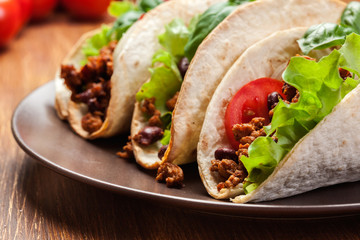 Mexican tacos with minced meat, beans and spices