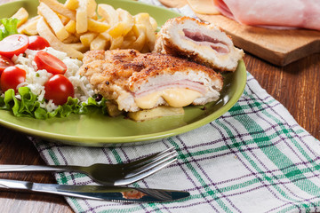 Cutlet Cordon Bleu with pork loin served with French fries and salad