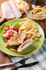 Cutlet Cordon Bleu with pork loin served with French fries and s