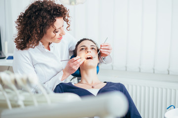 Female dentist working in her dentist office.