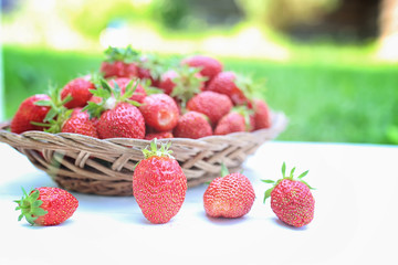 Strawberry on wicker bag outdoor