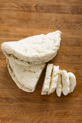 Homemade dairy, soft cheese, milk product on wood