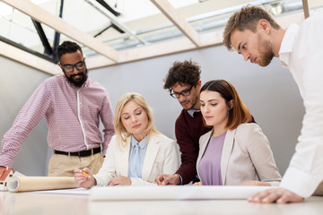 business team discussing house project at office