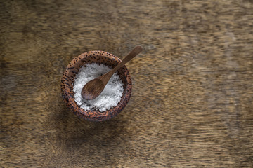 Coconut plate with salt and spoon