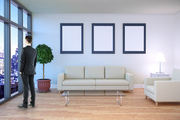 Businessman in room with frames