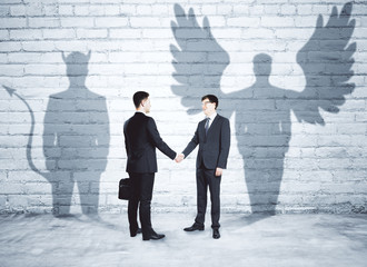 Fototapeta premium Angel and demon partners