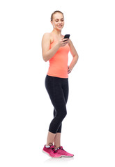 happy smiling sportive young woman with smartphone