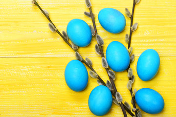 traditional eggs painted in blue color with blossoming willow twigs