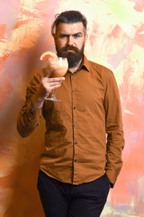 Brutal caucasian hipster holding tropical alcoholic fresh cocktail