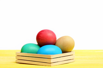 traditional colorful easter eggs painted in wooden box