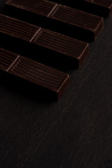Close-up of dark chocolate bar tiles