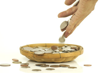 hand put coins money  in basket for save isolated and white background