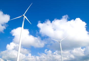 Wind turbine electricity on blue sky background
