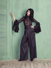 Naklejka premium Model wearing black troussers and blouse