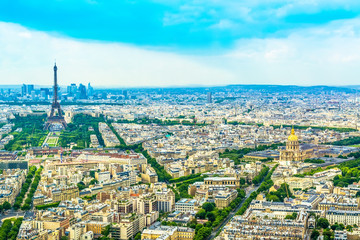 Fototapeta na wymiar Panorama Eiffel Tower in Paris from a height on a sunny day with a blue sky. A view of Paris from a bird's-eye view.
