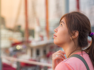 Beautiful Young Asian - Chinese Woman Thinking in Harbor