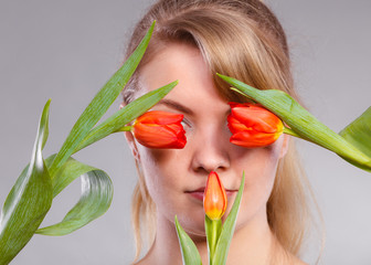 Girl with tulip feel connection to nature.