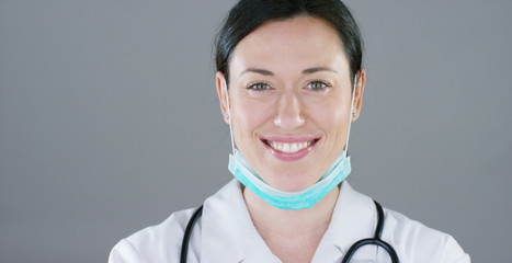 close up portrait of a woman surgeon or doctor with mask ready for operation in hospital or clinic.