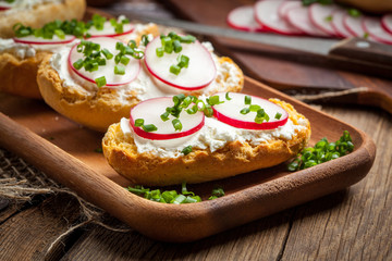 Toasts with radish, chives and cottage cheese.